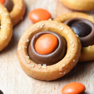 pretzel ring filled with a melted Hershey's kiss and orange M&M