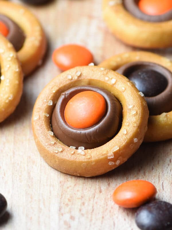 pretzel ring filled with a melted Hershey's kiss and orange M&M