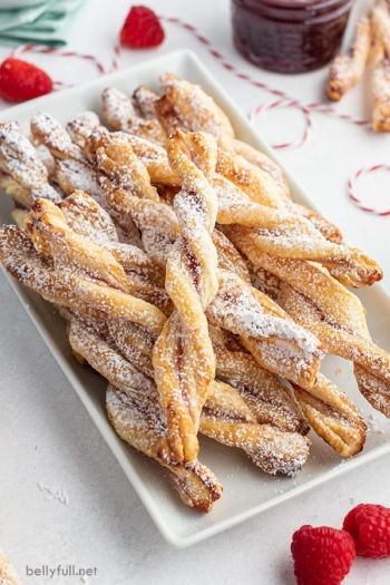 pile of jam pastry straws on white serving tray