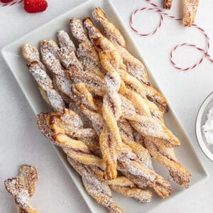 overhead of jam puff pastry twists on white serving tray