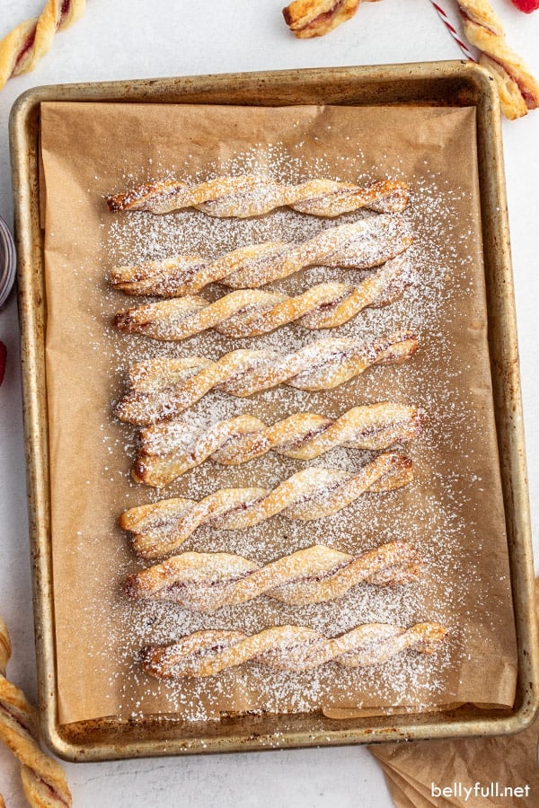 overhead of puff pastry twists on brown parchment paper