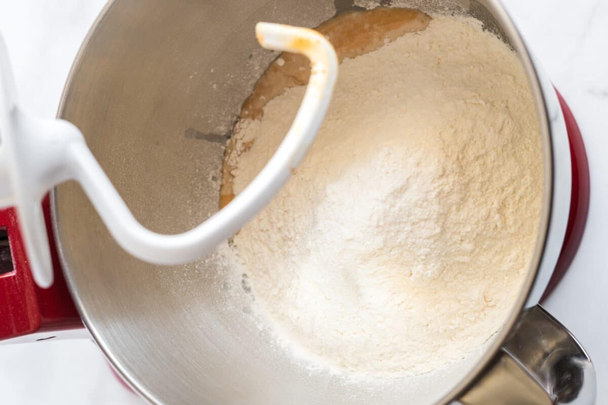 making the dough for Pumpkin cinnamon roll in the bowl of a mix master.
