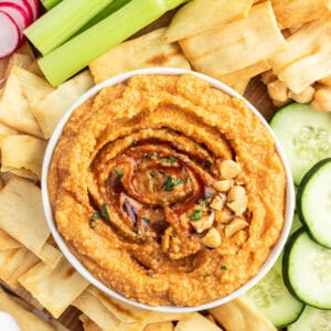 overhead of hummus in bowl with barbecue sauce