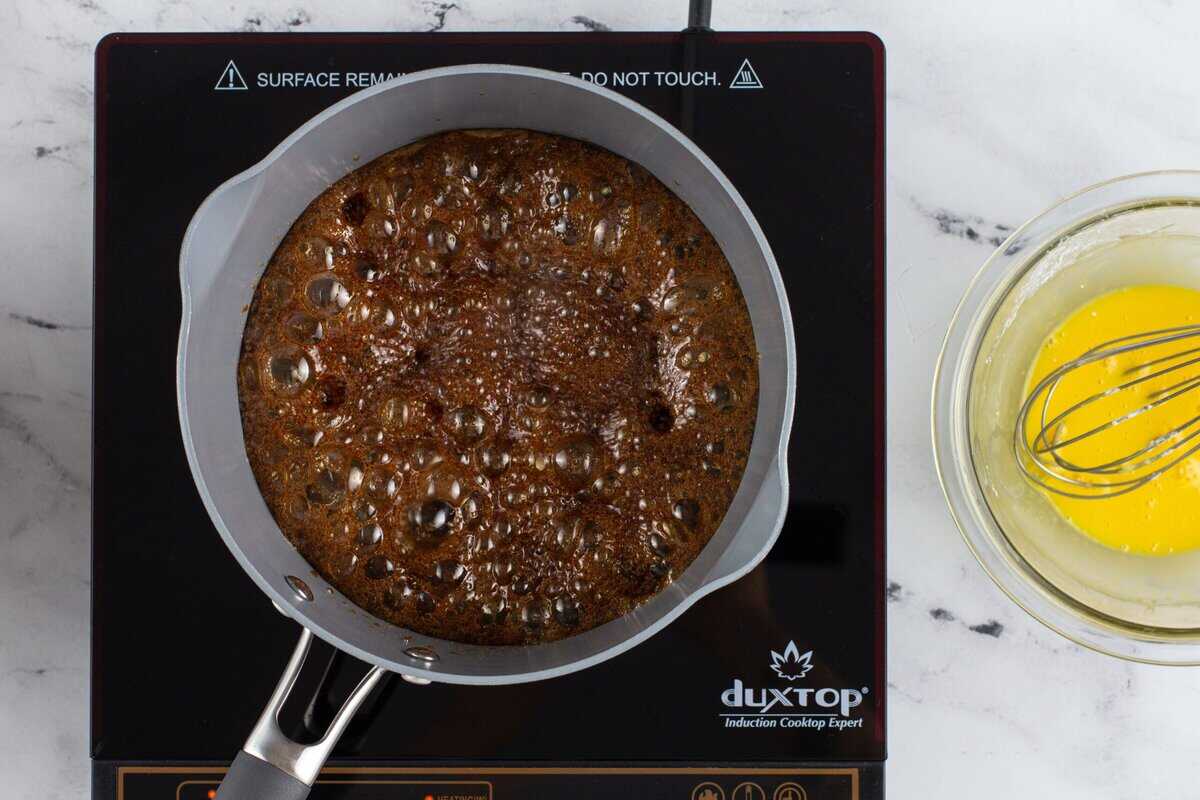 Cooking brown sugar, water, and salt in a pot.