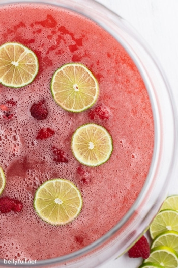 overhead close up of holiday punch with floating lime slices