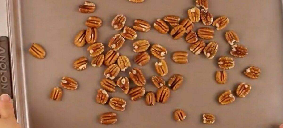 Pecans on a cookie sheet.