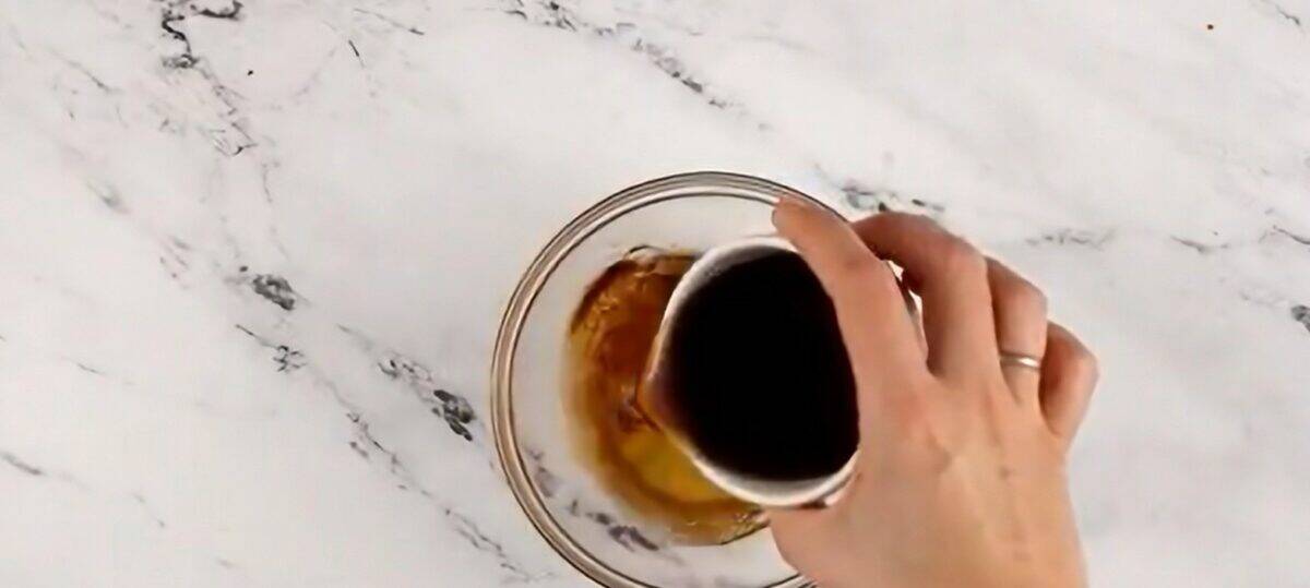 Combining the rum and the honey.