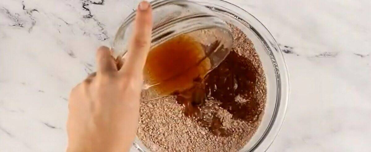 Adding the rum and honey mixture to the dry ingredients.