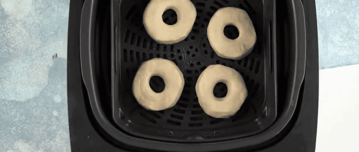 Air fryer donuts in the air fryer.