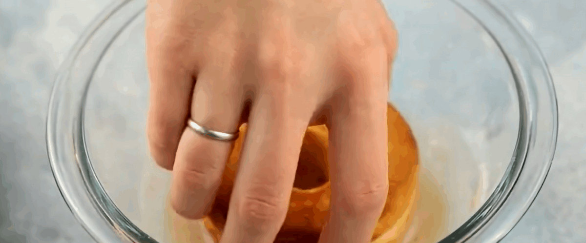 Dipping the donuts in the glaze.