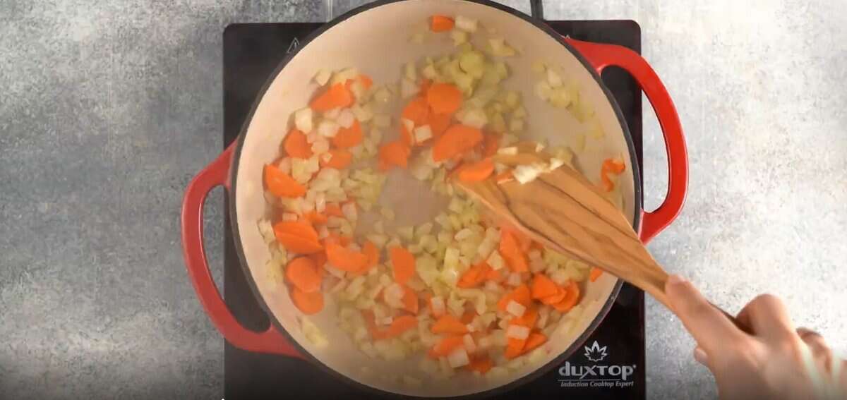 Sauteeing the vegetables in a Dutch oven.