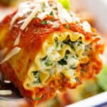 close up lasagna roll on serving spatula