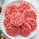 overhead of fanned strawberry cake mix cookies on white plate