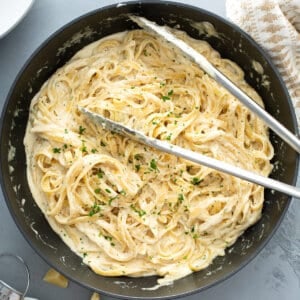 overhead pan with cooked fettuccine Alfredo