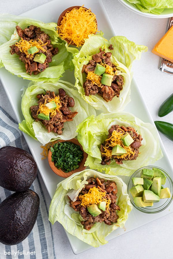 overhead of 5 beef lettuce cups on white serving tray