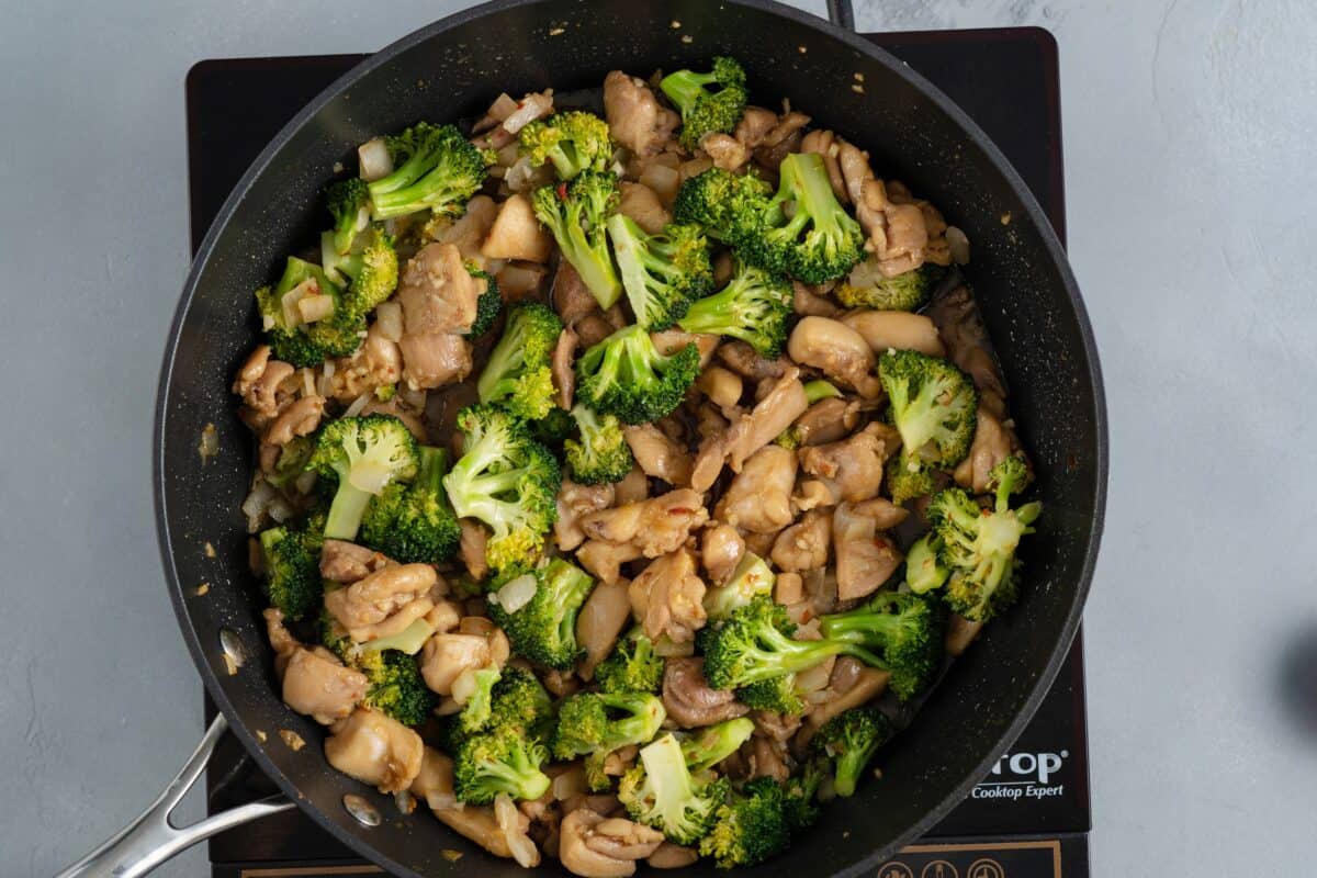 Chicken and vegetables in the skillet.