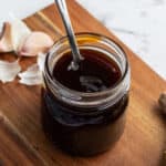 homemade Teriyaki sauce in glass jar with spoon