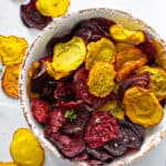 overhead baked red and golden beet chips in bowl