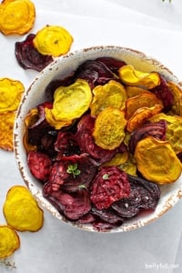 overhead baked red and golden beet chips in bowl