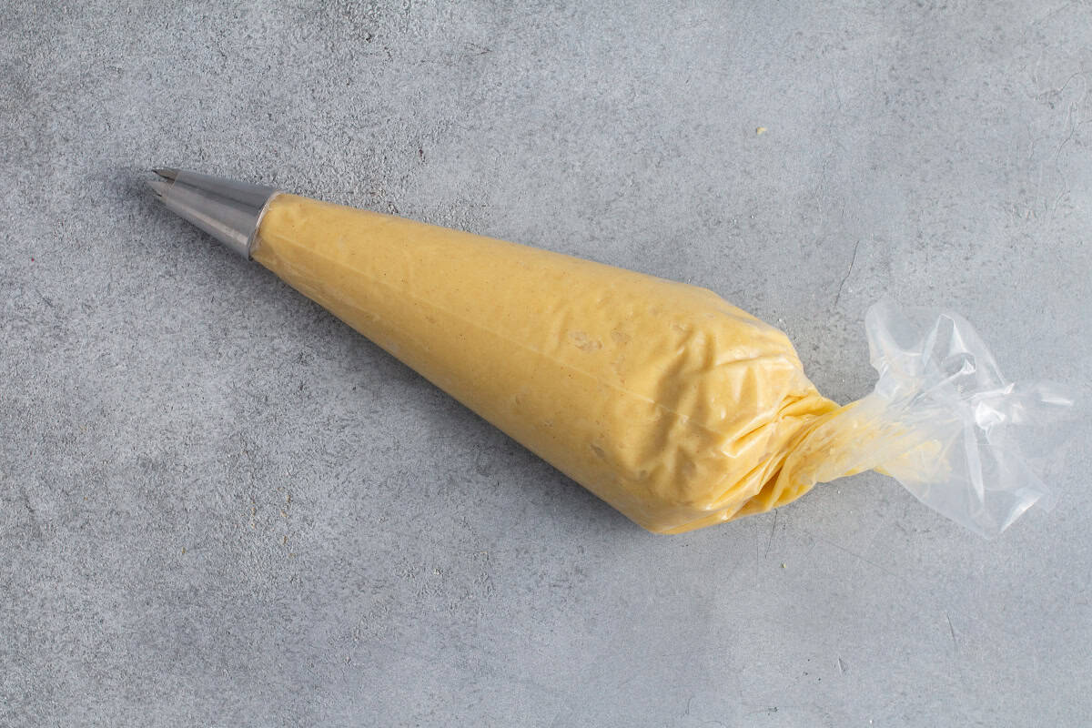 Churro dough in a piping bag.