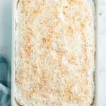 creamy coconut cake with toasted coconut overhead