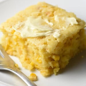 portion of cornbread pudding on white plate