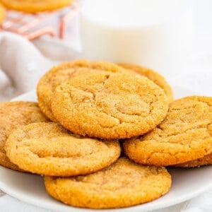 pile of brown sugar cookies on white plate