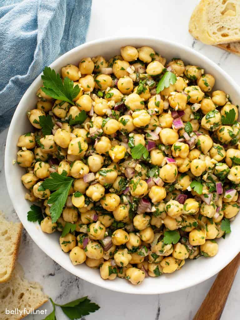 overhead close up white serving bowl filled with Chickpea Salad