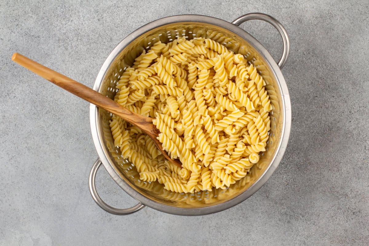 Cooked pasta in a colander.