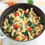 Creamy Lemon Pasta with tomatoes and spinach in pot