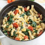 Creamy Lemon Pasta with tomatoes and spinach in pot