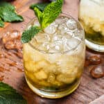 Mint julep cocktail on wooden board