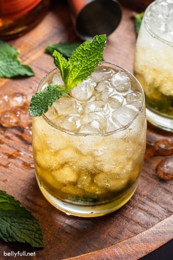 Mint julep cocktail on wooden board