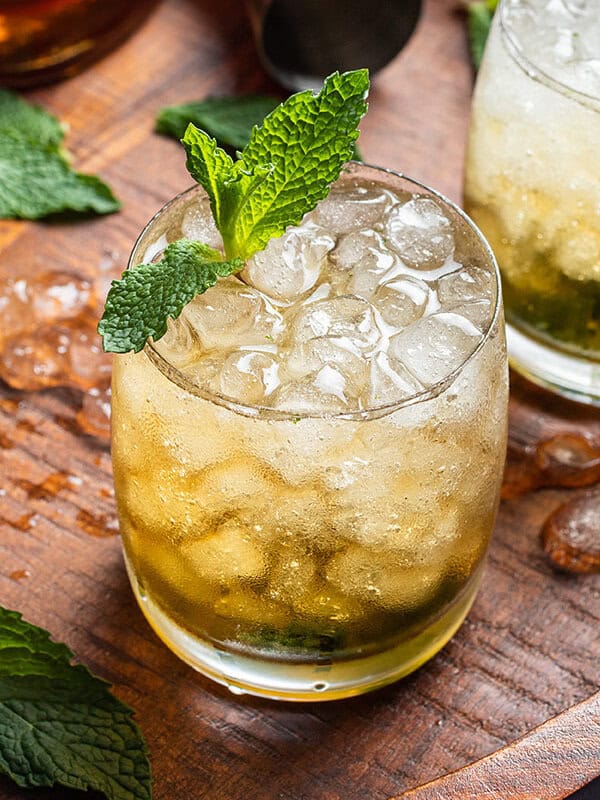 Mint julep cocktail on wooden board
