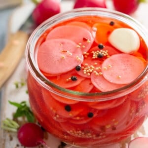 pickled radish slices and seasonings in small glass jar