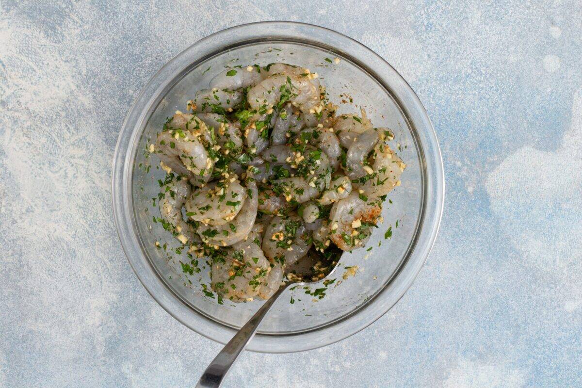 Shrimp in a bowl with seasoning. 