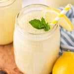 Lemon Smoothie in glass jar with striped straw and mint garnish