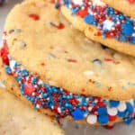 close up cookie ice cream sandwich rolled in red white blue sprinkles