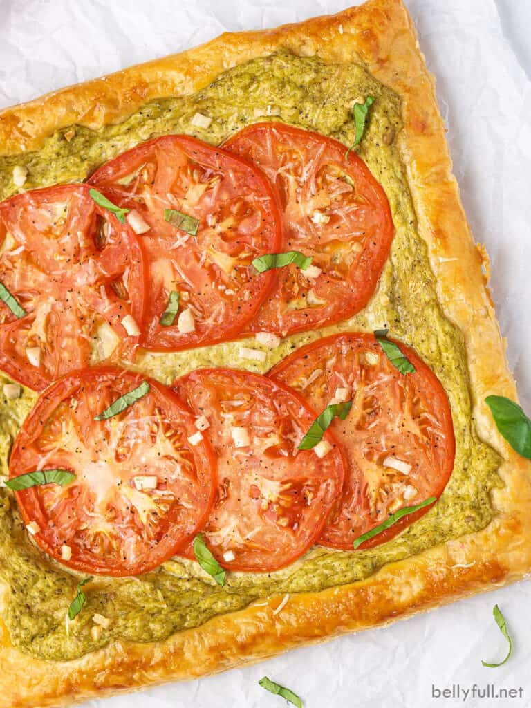 overhead baked tomato tart on parchment paper