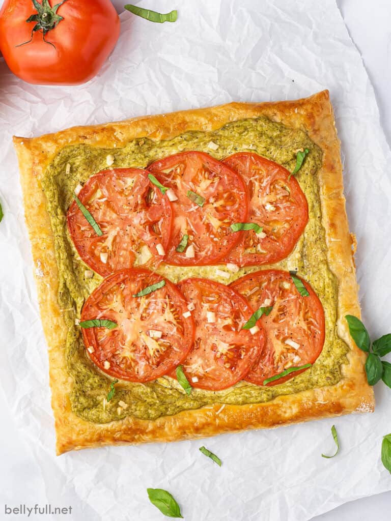 overhead whole tomato tart on parchment paper