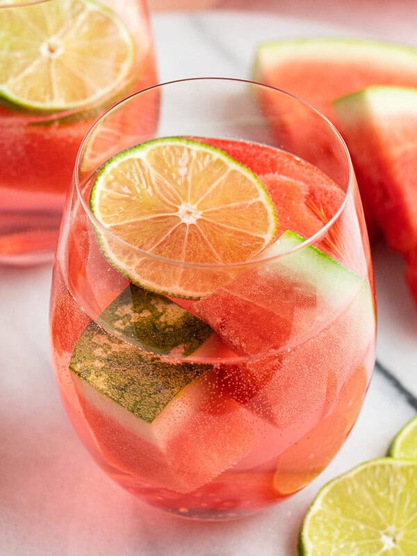 glass filled with watermelon sangria and lime slice