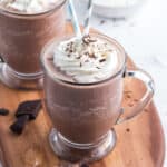 frozen hot chocolate drink in glass with whipped cream