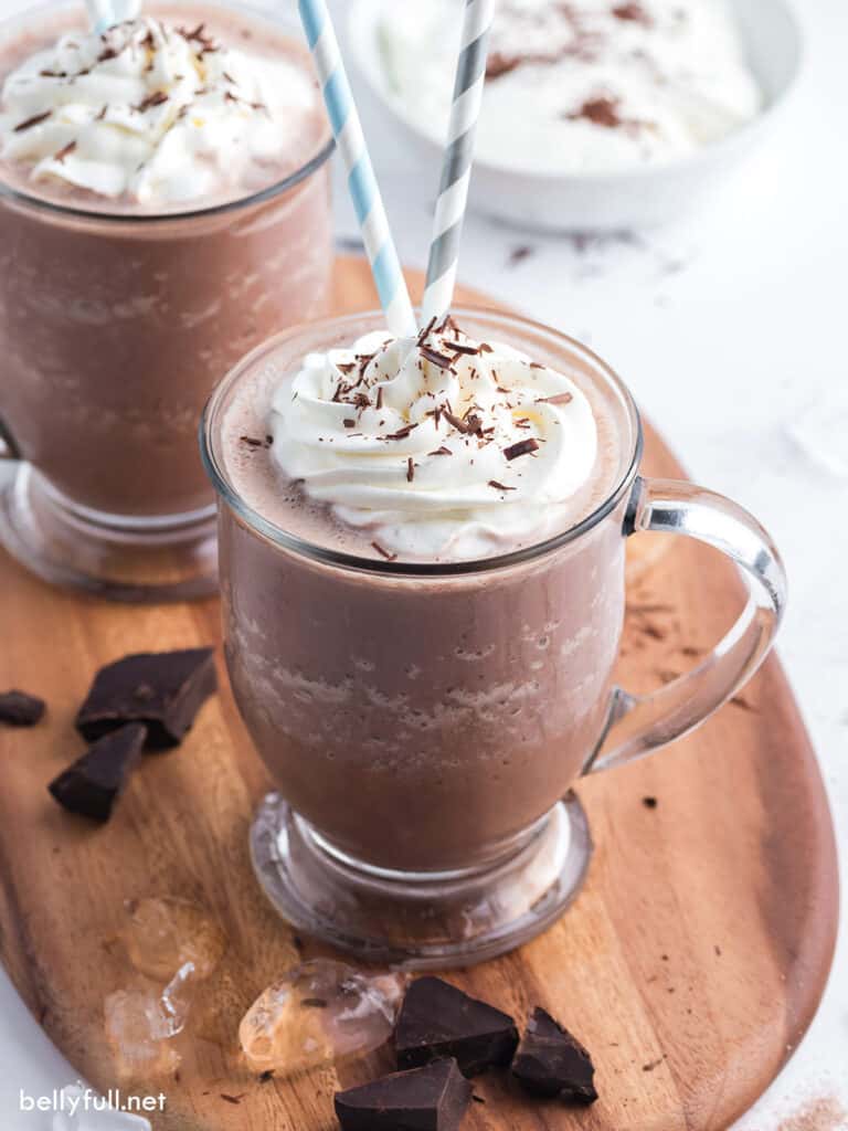 frozen hot chocolate drink in glass with whipped cream