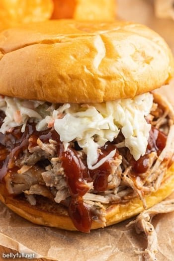 pulled pork sandwich with coleslaw and BBQ sauce