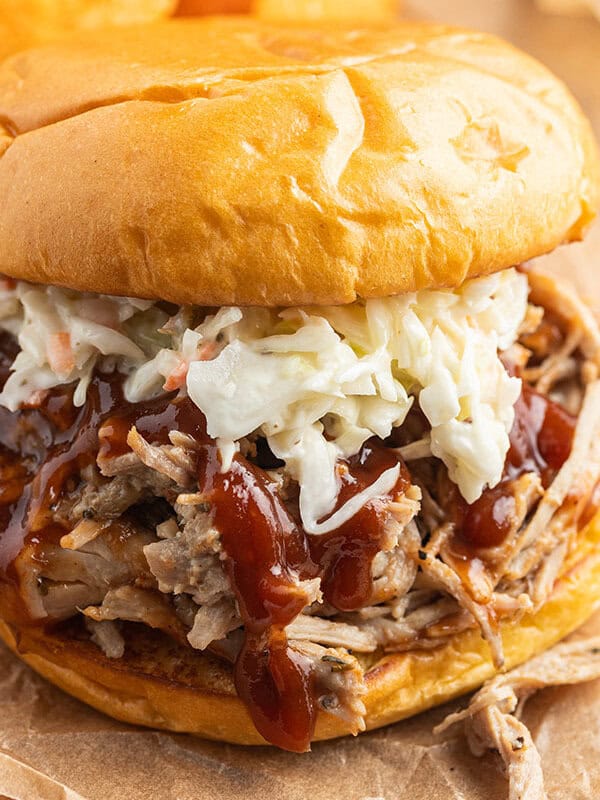 pulled pork sandwich with coleslaw and BBQ sauce