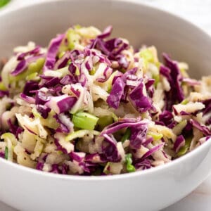 white bowl of red cabbage slaw