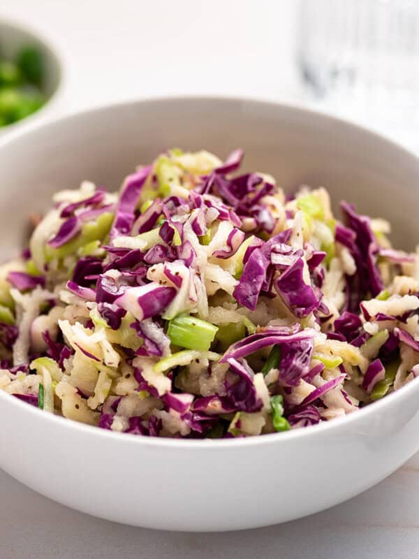 white bowl of red cabbage slaw