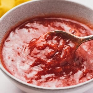 strawberry topping in bowl with spoon