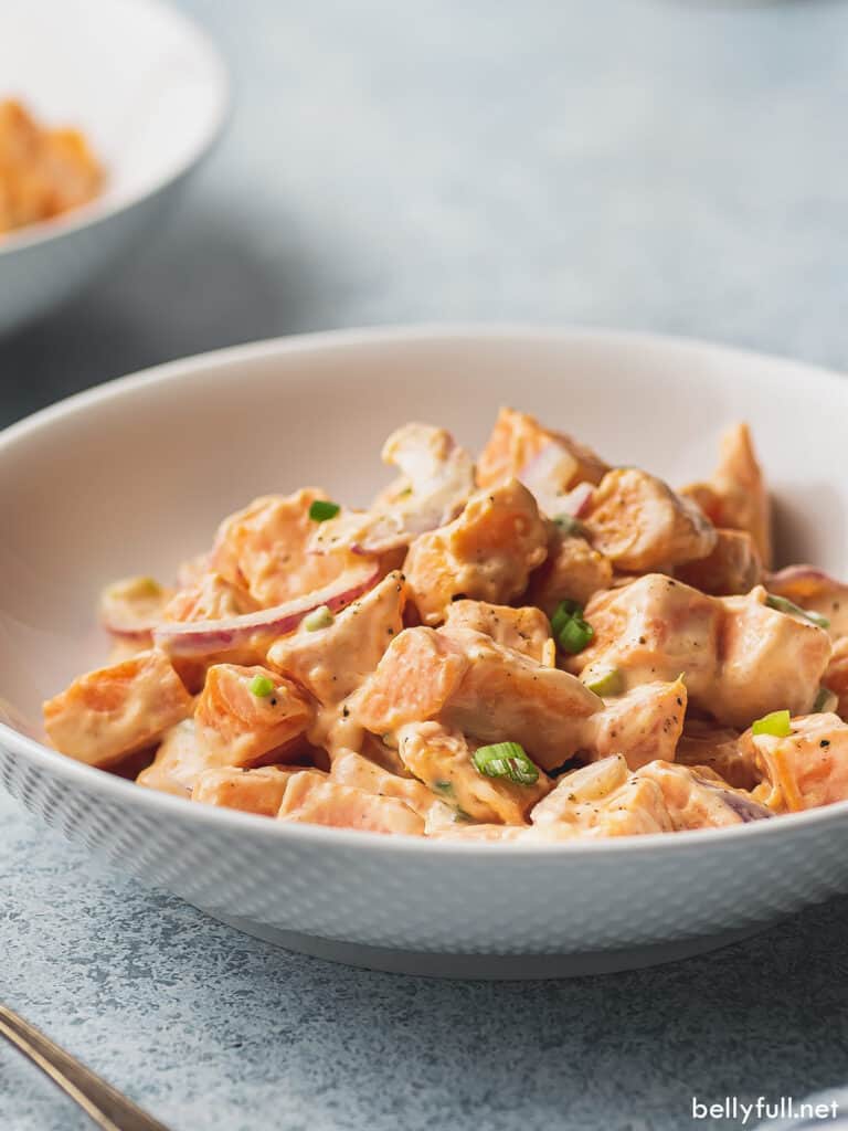 side angle of creamy sweet potato potato salad in bowl