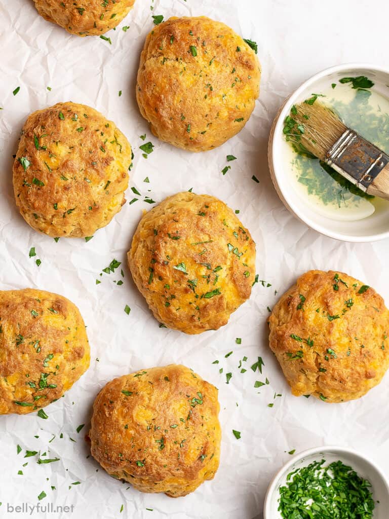 5 cheddar bay biscuits on parchment paper